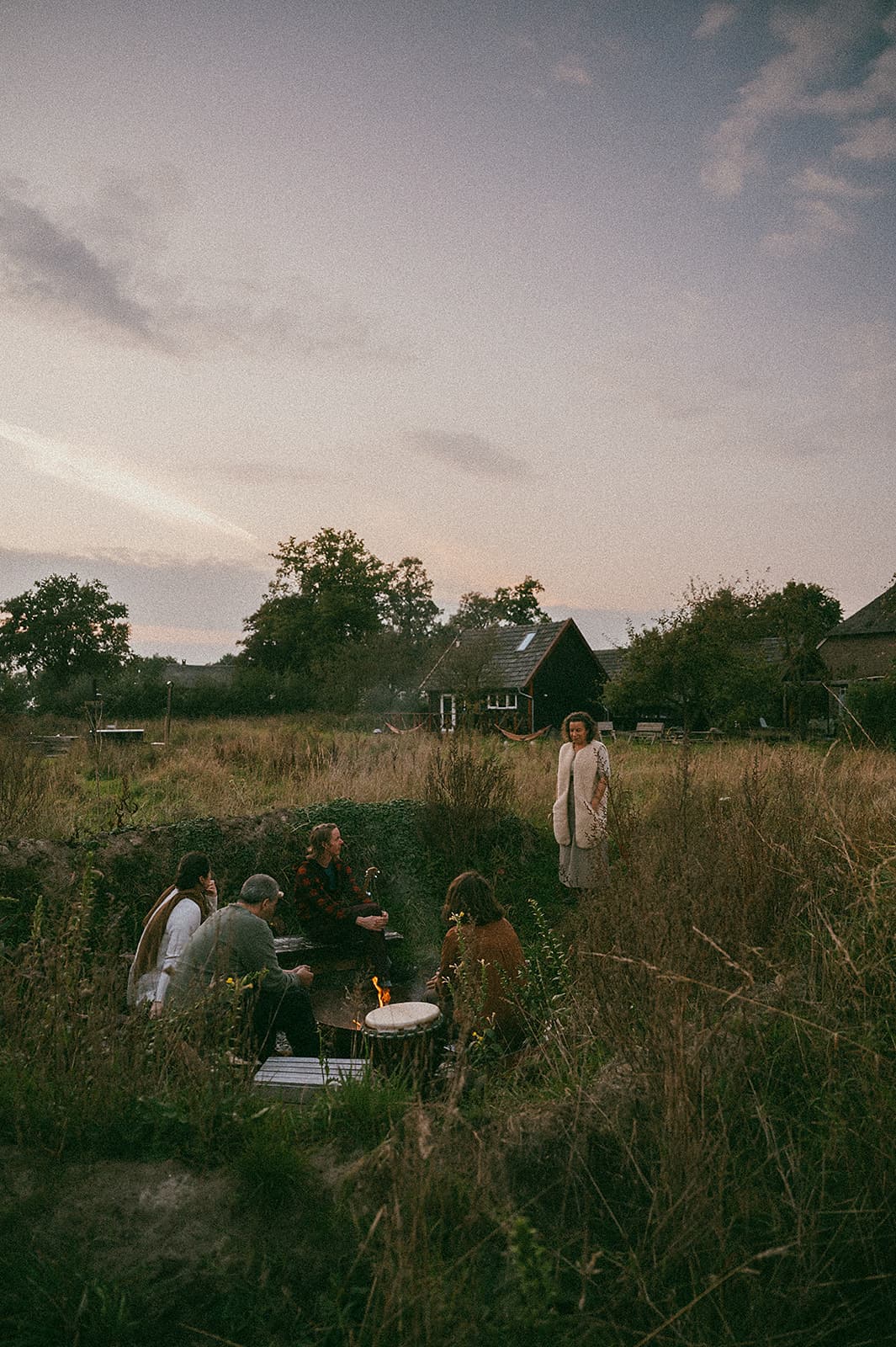 Gathering around the fire circle at The Makers Barn