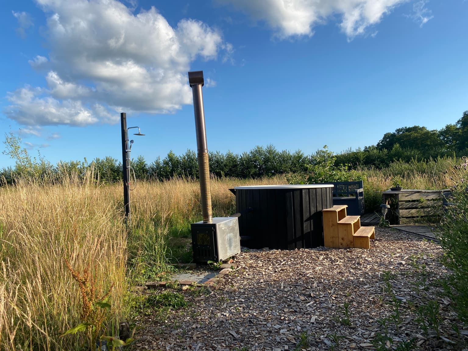 Hot tub in the field at The Makers Barn