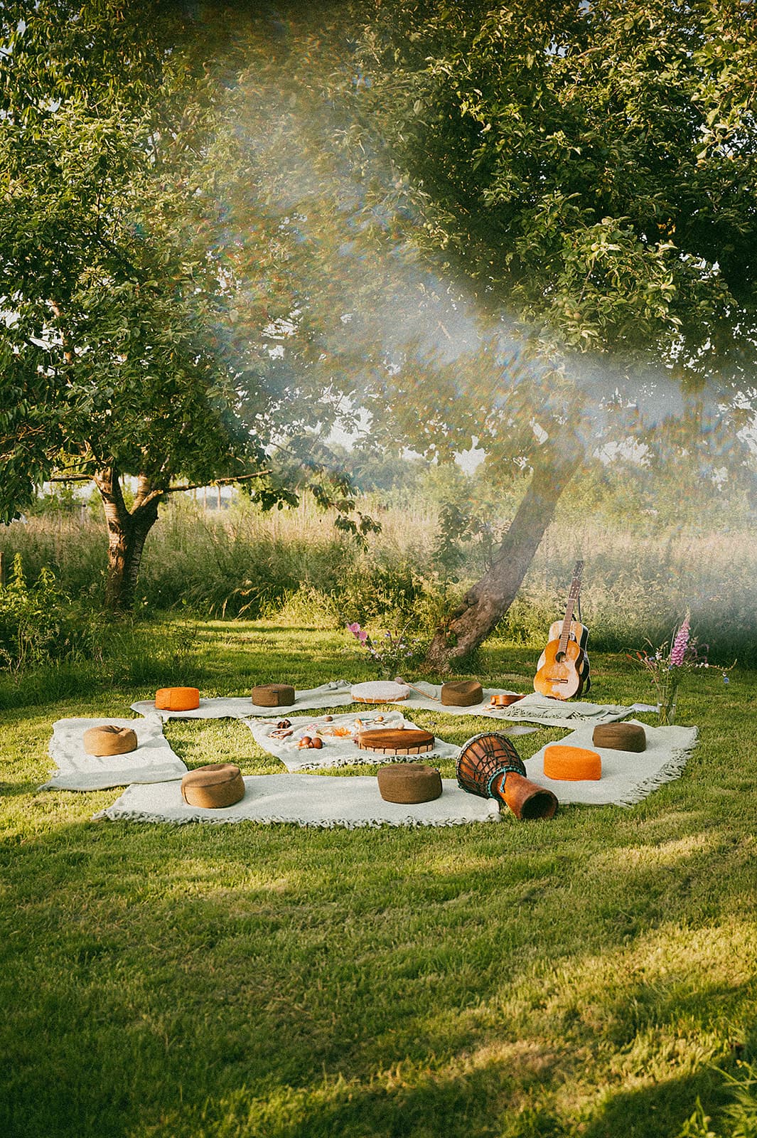 Outdoor guitar circle gathering at The Makers Barn
