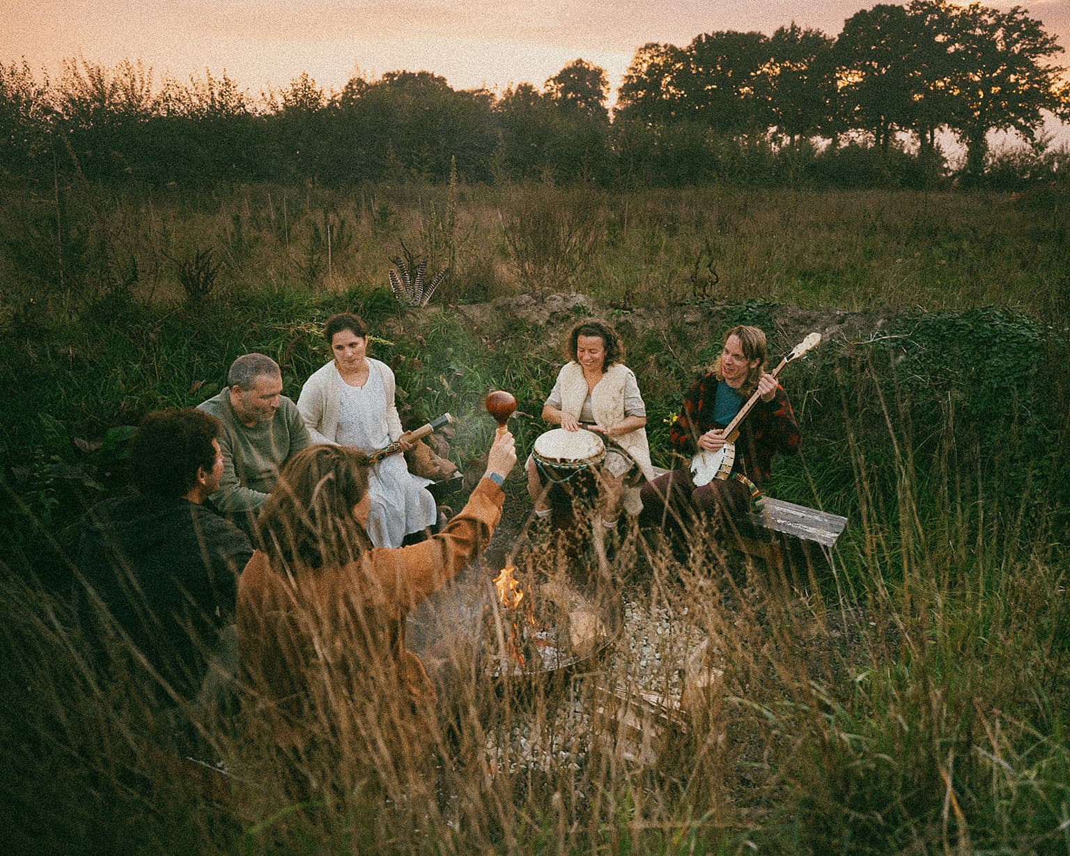 Playing music around the fire pit at The Makers Barn