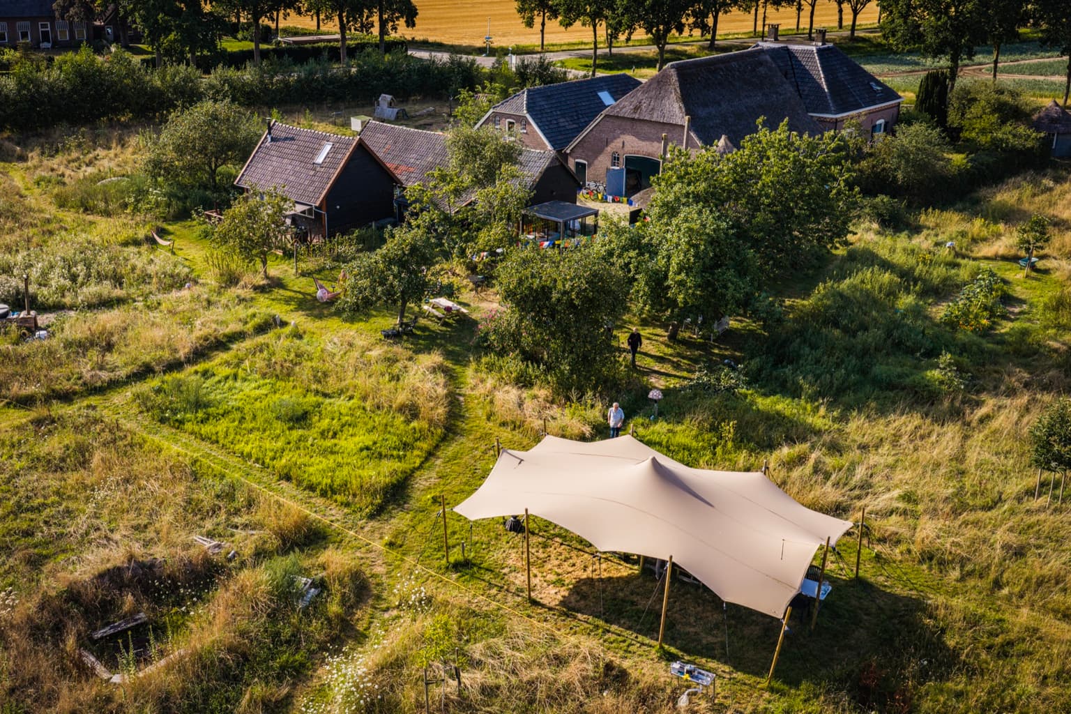Aerial view of the farm with the retreat tent in the orchard