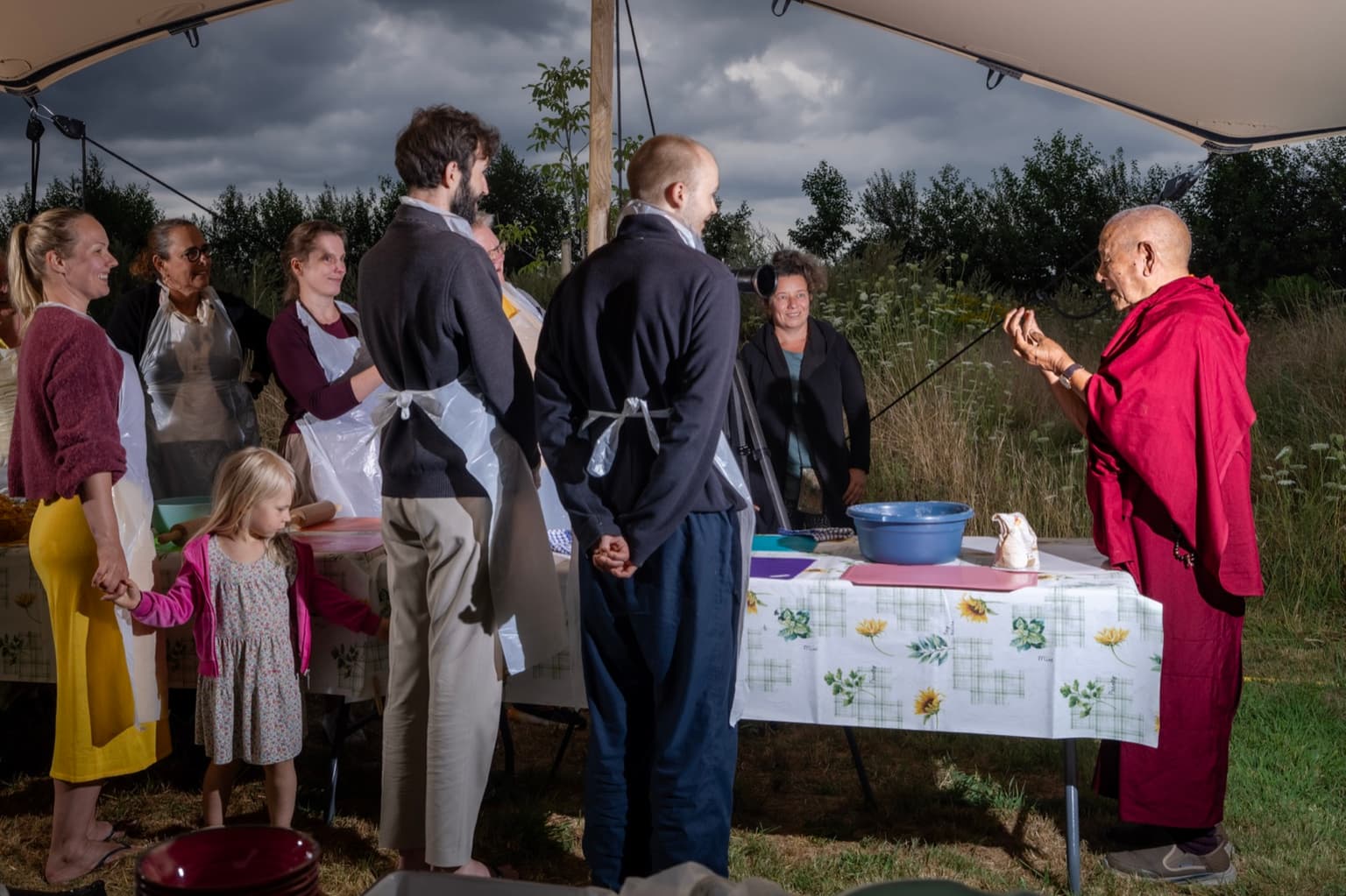 Geshe Pema Dorjee showing the group how to fold Tibetan momos